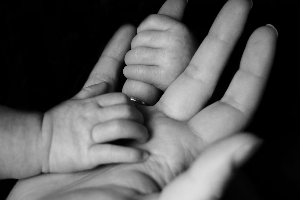 Baby holding Father's Hand