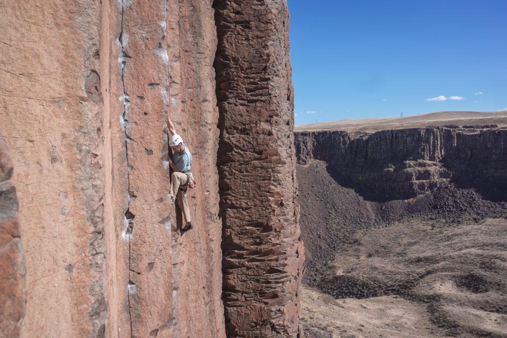 Man climbing a vertical wall